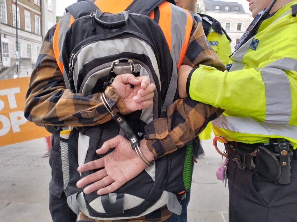 Friends being arrested for peaceful protest